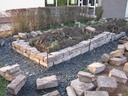 Der Schulgarten bekommt eine Natursteinmauer